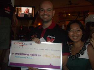 Ms Stella Pham from Flight Travel awards the winning trip to Hong Kong to Jerry! Jerry! Jerry!